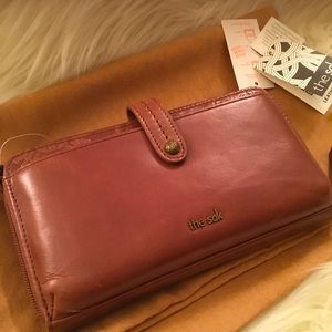 NWT floral embossed “the Sak” wallet/crossbody